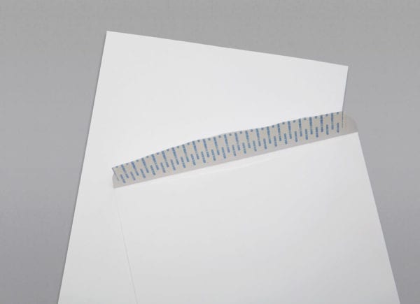 Close up of the front and back of a 12 x 15 1/2 Catalog Envelope 28# White Wove with Peel & Stick