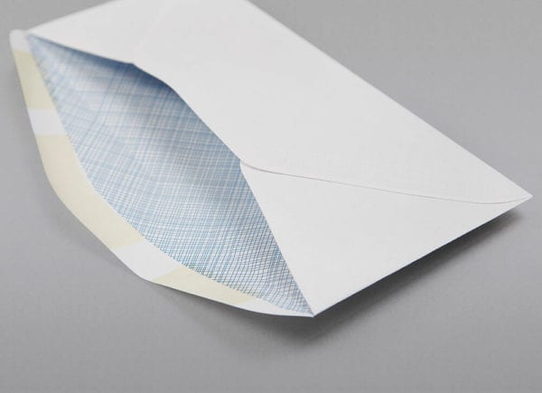 Close up of the back of a 8 5/8 Check Window Envelope Blue Security Tint with Regular Gum