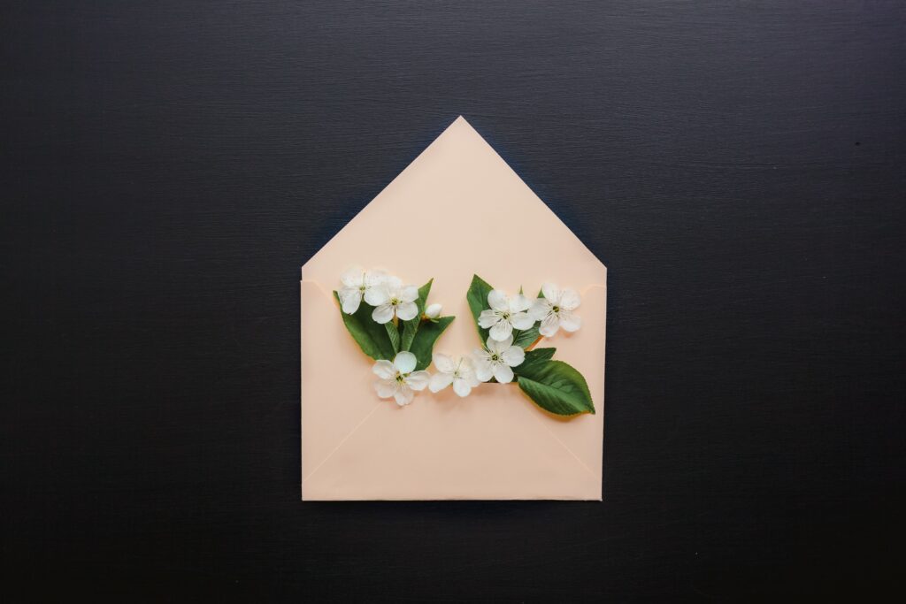 Printed envelope with flowers. Paper beats emails in the sustainability game.