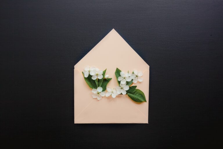 Printed envelope with flowers. Paper beats emails in the sustainability game.